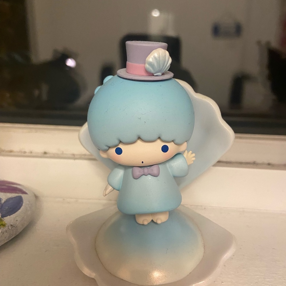 Blue and white Sanrio angel shell figurine